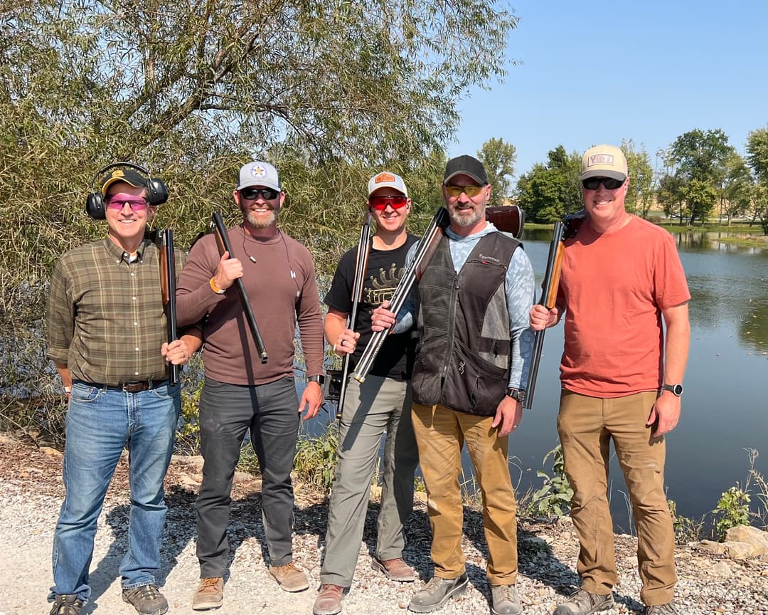 The five Honoring Heroes board members at a sporting clay range.